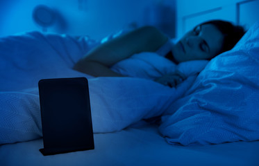 Blank clock with copy space, Woman sleeping in bed