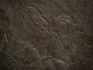 Dark grunge textured wall closeup