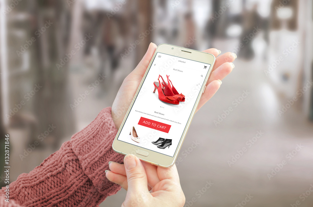 Poster woman holding smart phone with commerce web site. user friendly app interface with woman shoes. shop