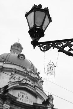 Street lantern with metal handcraft and ancient cathedral background
