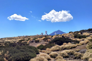 Beautiful landscape with set of astronomical observatory buildings and Teide volcano in the...