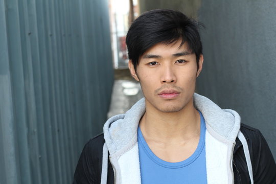 Confident Asian Man Portrait Isolated with Copy Space
