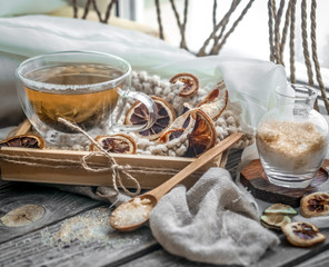 still life with transparent Cup of tea on wooden background