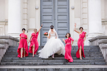 Wedding guests, bride and bridesmaids going to place of wedding ceremony