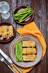 Bread crumbs cheese herbs baked cod with green beans