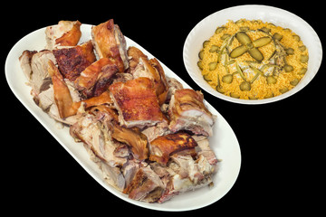 Plateful of Spit Roasted Pork Slices with Olivier Salad in White Porcelain Bowl Isolated on Black Background