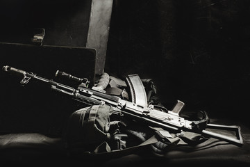 machine gun AK, military helmet and ammunitions