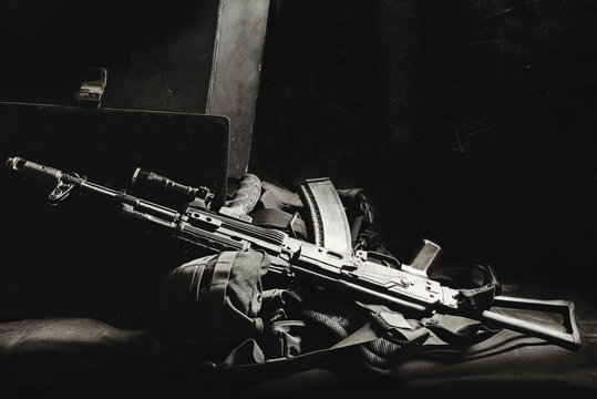 machine gun AK, military helmet and ammunitions