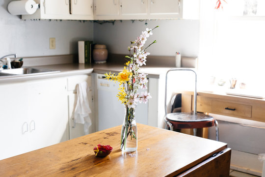 Flowers in vase on the table in the kitchen