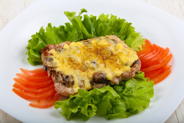Pork steak with mushroom and cheese