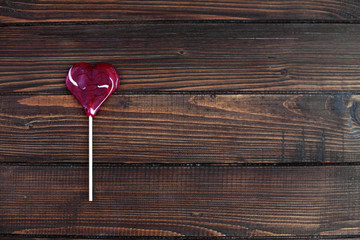Heart candy on a wooden background. The concept of love 