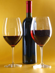 on the table a bottle of wine and glass