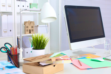 office desk with a computer in the foreground