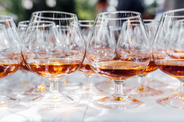 Glasses of brandy on a banquet. Catering