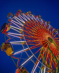 Brightly Lit Ferris Wheel at a Carnival