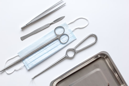 instruments for plastic surgery on white background top view