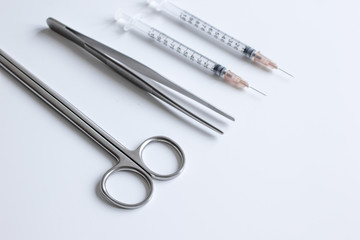 instruments for plastic surgery on white background