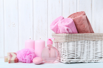 Towels with soap and wisp on white wall paneling background