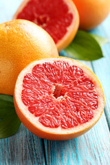 Grapefruit fruits on a blue wooden table