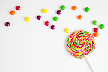 sweets and sugar candies on white background top view