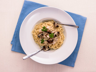 Spaghetti carbonara with brown mushroom