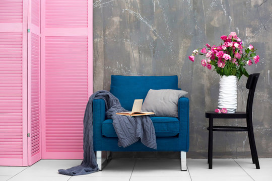 Modern room interior with pink wooden screen