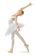 Young beautiful ballerina dancer posing on light background