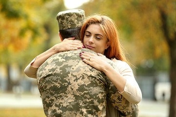 Soldier reunited with wife on a sunny day