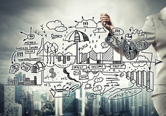 Fototapeta premium Woman sketching business ideas 