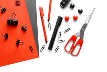Red and black stationery on white background