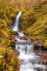 Fototapeta na wymiar Beautiful waterfall in Carpathians