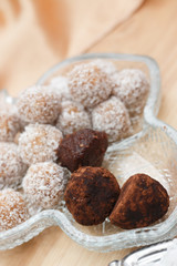 Truffles and chocolate balls with coconut flakes
