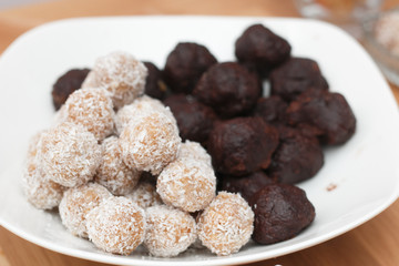Truffles and chocolate balls with coconut flakes