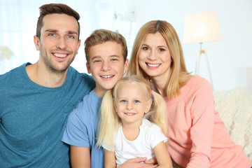 Fototapeta premium Cute happy family in living room