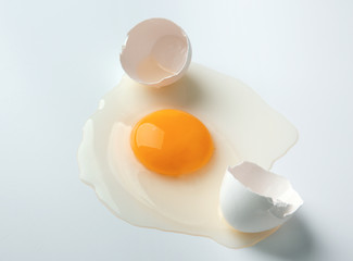 Raw egg yolk on white background
