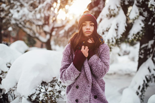 Stylish girl walking the street in winter