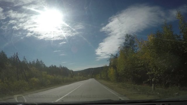 View from Car windshield. Road Trip on Suburban Road