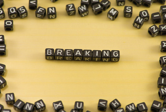 The word breaking on wood background
