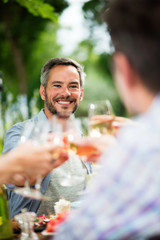 Group of friends toasting on the terrace