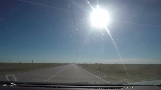 View from Car windshield. Road Trip on Suburban Road