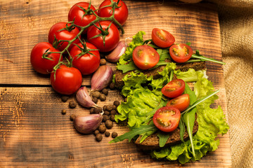 sandwich with tomatoes and arugula