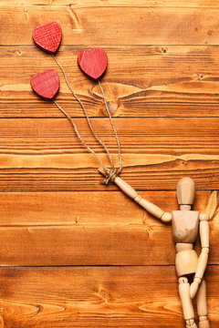 gestalta or poppet toy holding hearts