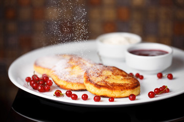 Frying homemade Cottage cheese pancakes Russian syrniki with swe