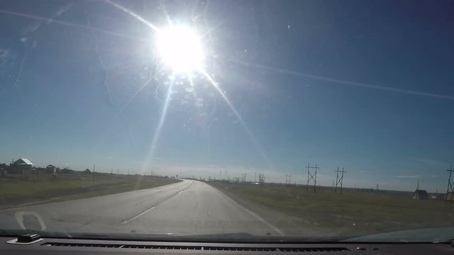 View from Car windshield. Road Trip on Suburban Road