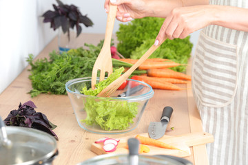 Fresh vegetables on the cutting board are falling in the pot, concept of cooking