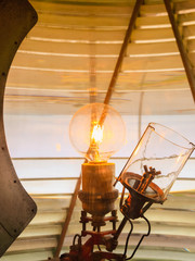 inside of a lighthouse showing the light bulb interior.