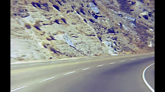 Vintage footage, point of view of car crossing Yosemite NP on 1970s, California, United States of America