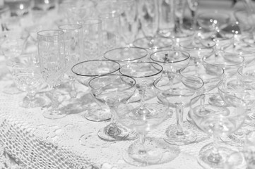 White table and row of glasses, celebration design set background