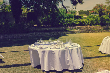Decorated celebrating event table on sunny day outdoors background