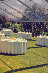 Decorated celebrating event table on sunny day outdoors background